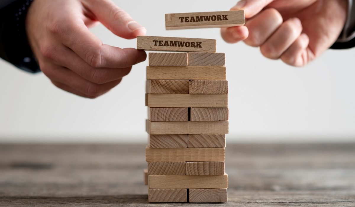 Wooden bricks with teamwork business signs